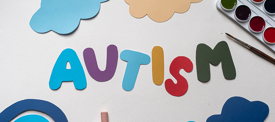 Crafted letters spelling 'Autism'.