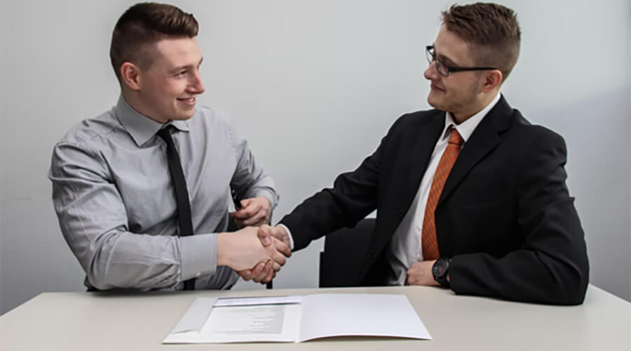 Young businessmen handshake