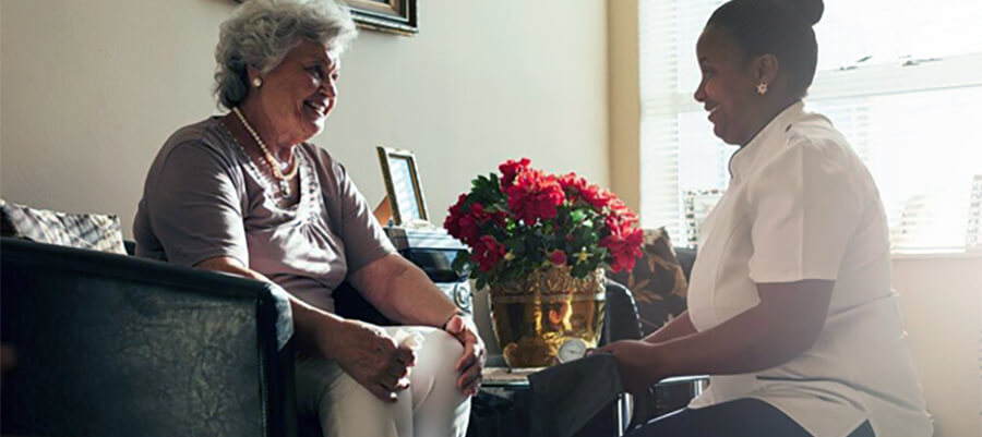 Nurse and patient in care home.