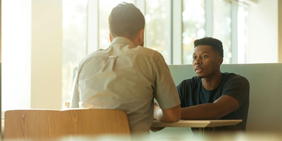 Man having a career development conversation.