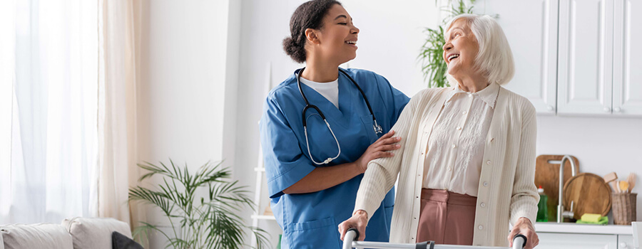 Caregiver working with an older lady.