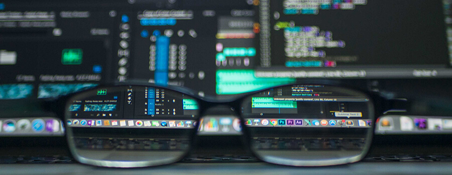 Glasses in front of a laptop screen.