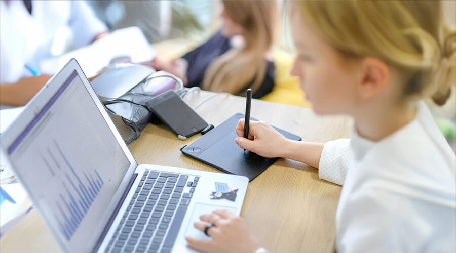 Designer working on a laptop.