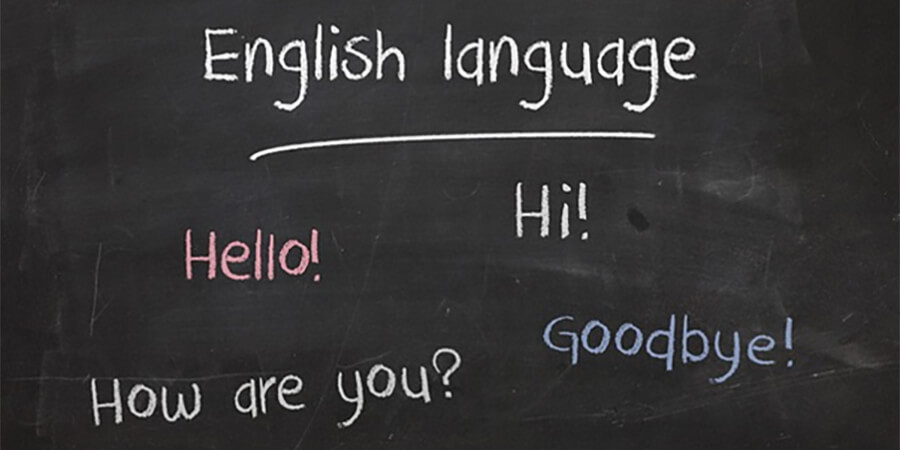 Blackboard with basic English words and phrases.