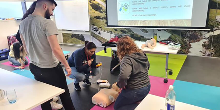 Practicing first aid with a resuscitation dummy.