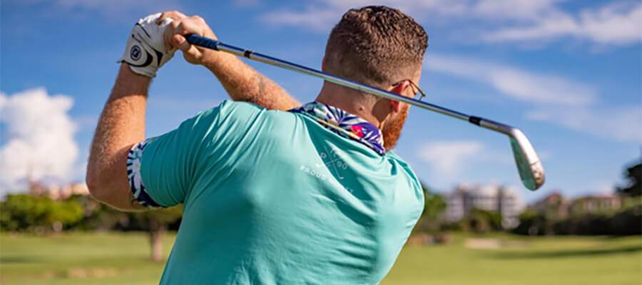 Golfer taking a swing.