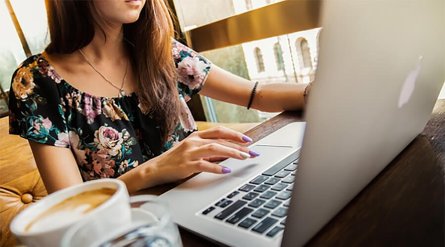 Close up of a Japanese lady using a laptop.