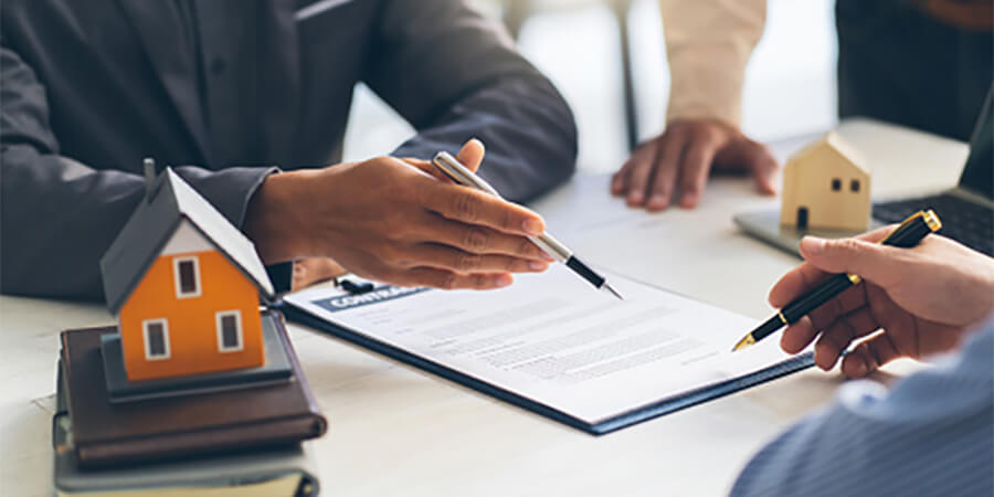 People negotiating a tenancy agreement.