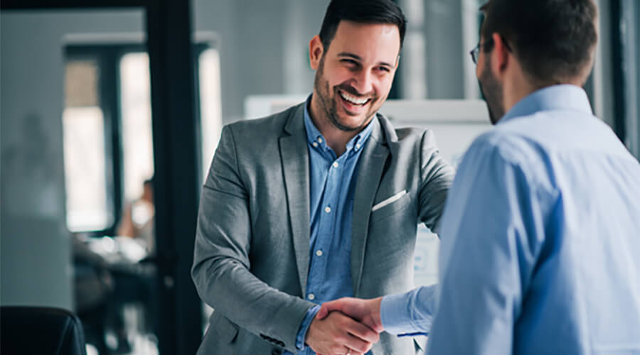 Two businessmen shaking hands.