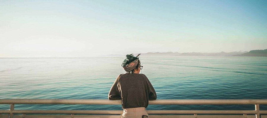 Person looking out across a Canadian lake.