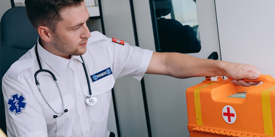 Medic with first aid box.