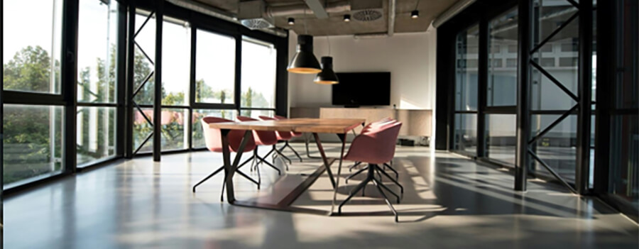 Modern office space with meeting table.