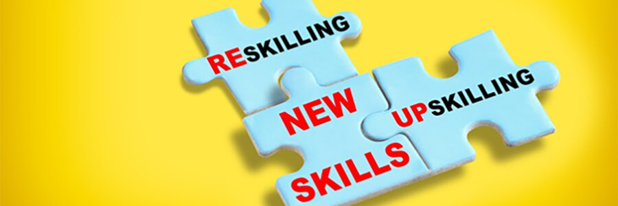 Jigsaw pieces with, 'Reskilling', 'New Skills' and 'UpSkilling'