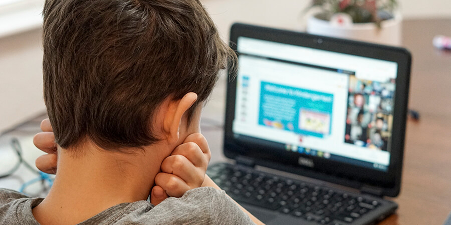 Male student studying online.