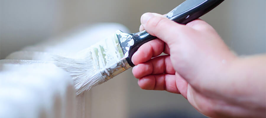 Painting a radiator.