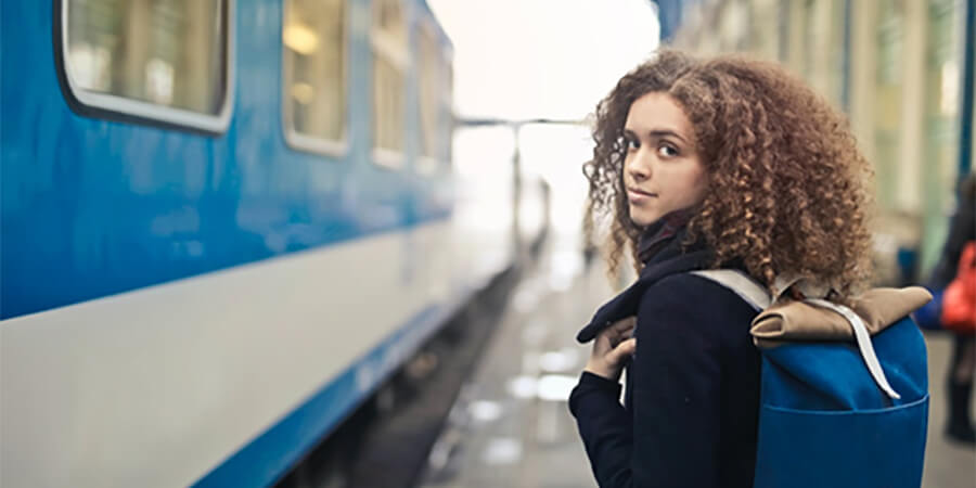 Student about to board a train.