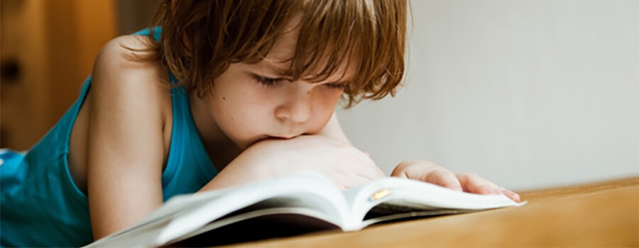 Close up of child reading.