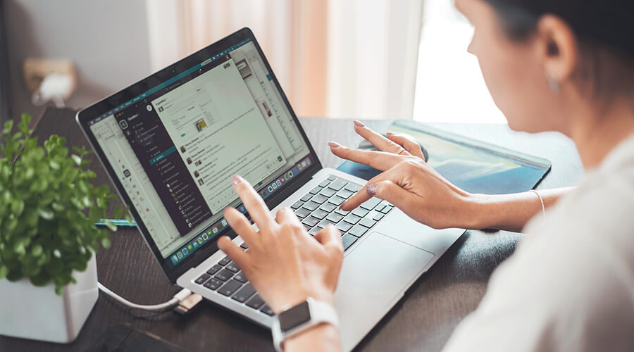 Person working remotely on a laptop.