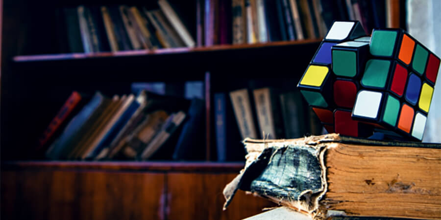 Rubik cube on an old book.