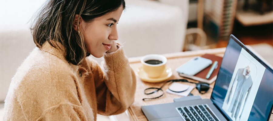 Woman working on a laptop.