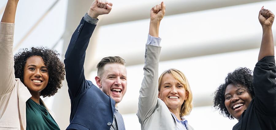 A group of people punching the air.