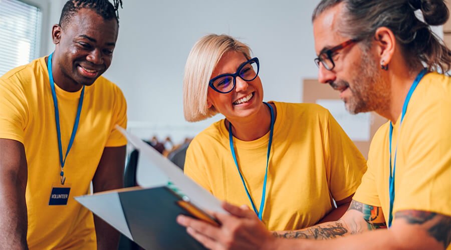 Volunteers wearing yellow tee-shirts.