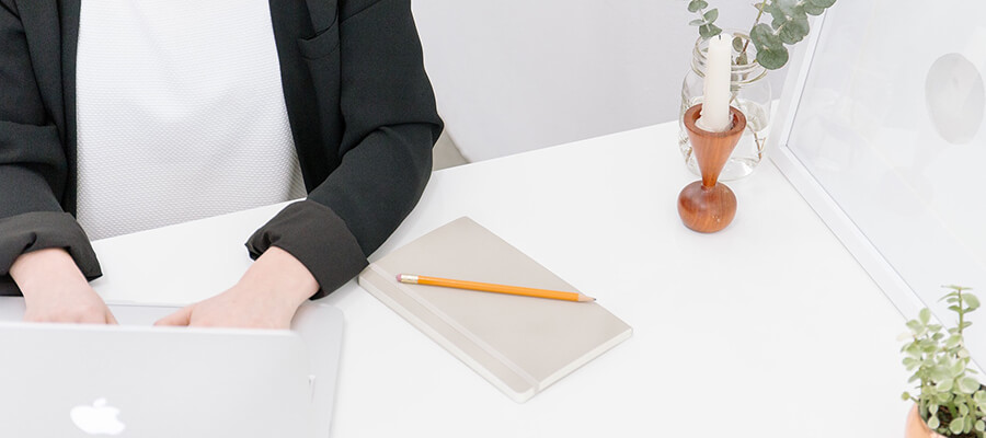 Woman working at a desk.