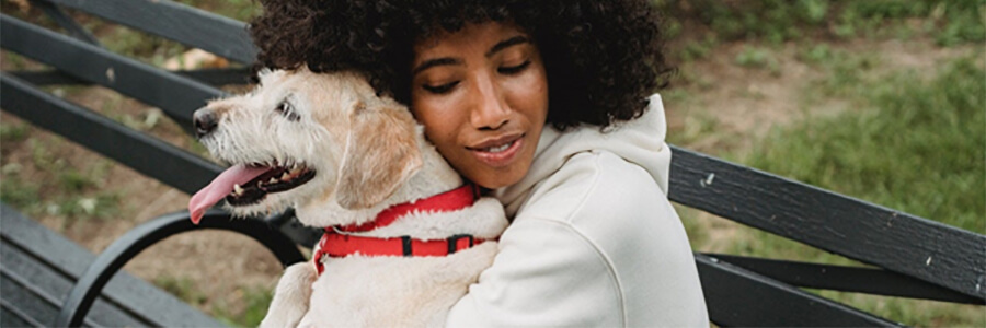 Woman hugging her dog.