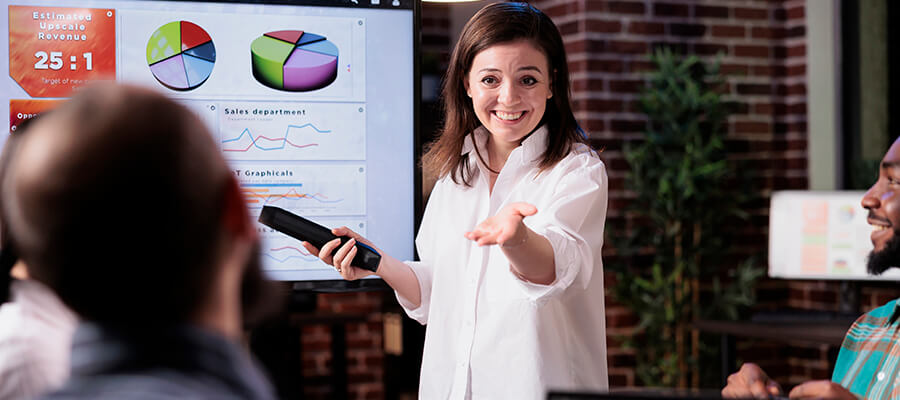 Woman presenting pie charts.